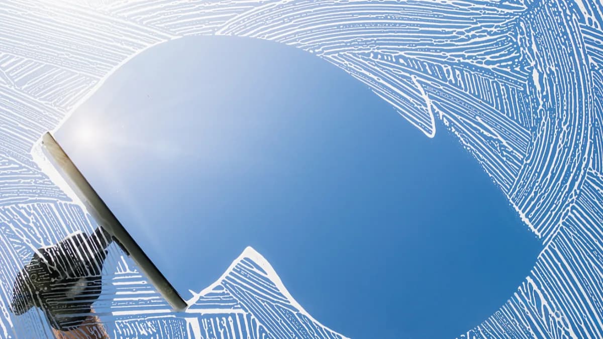 Close-up of clean glass after a squeegee pass